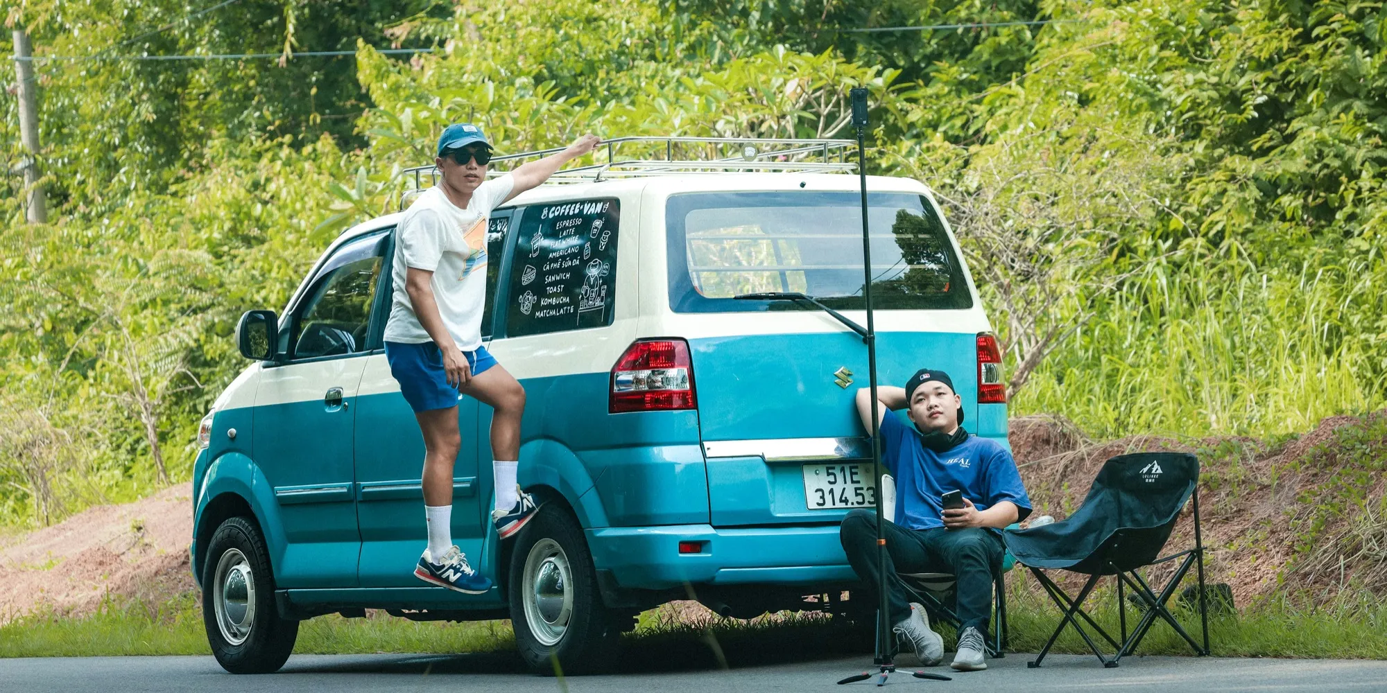 Two friends on a road trip with their van in Thailand